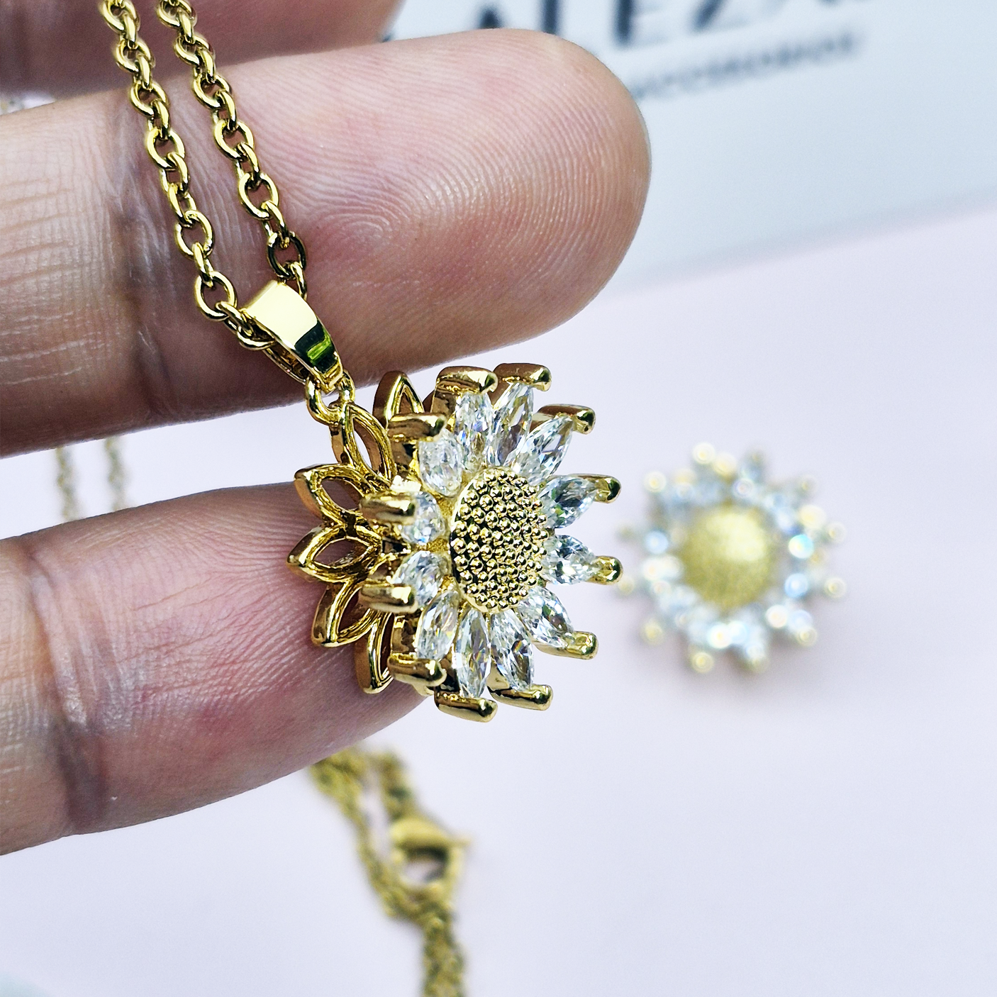 SET COLLAR Y ARETE GIRASOL GIRATORIO